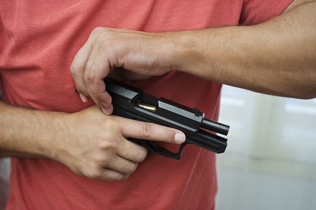 Man loads a gun pistol