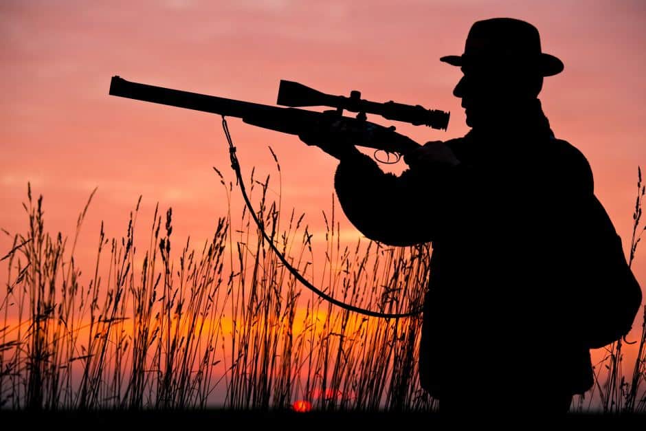 Image of a man holding rifle silhouette