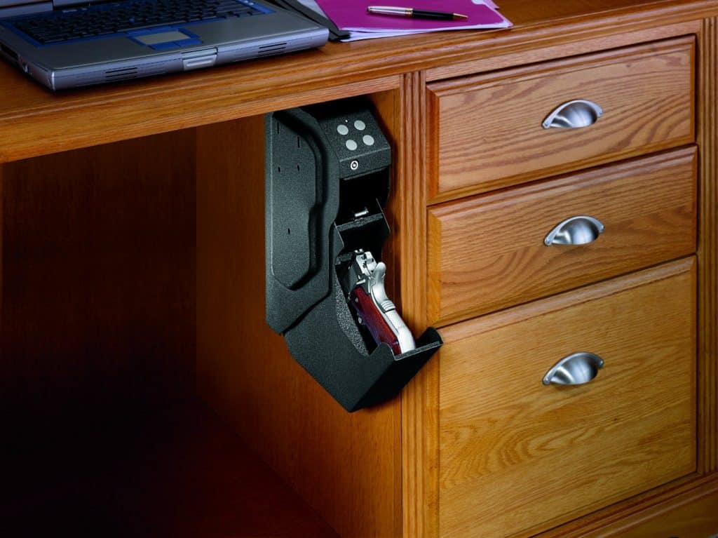 Small biometric gun safe under a desk