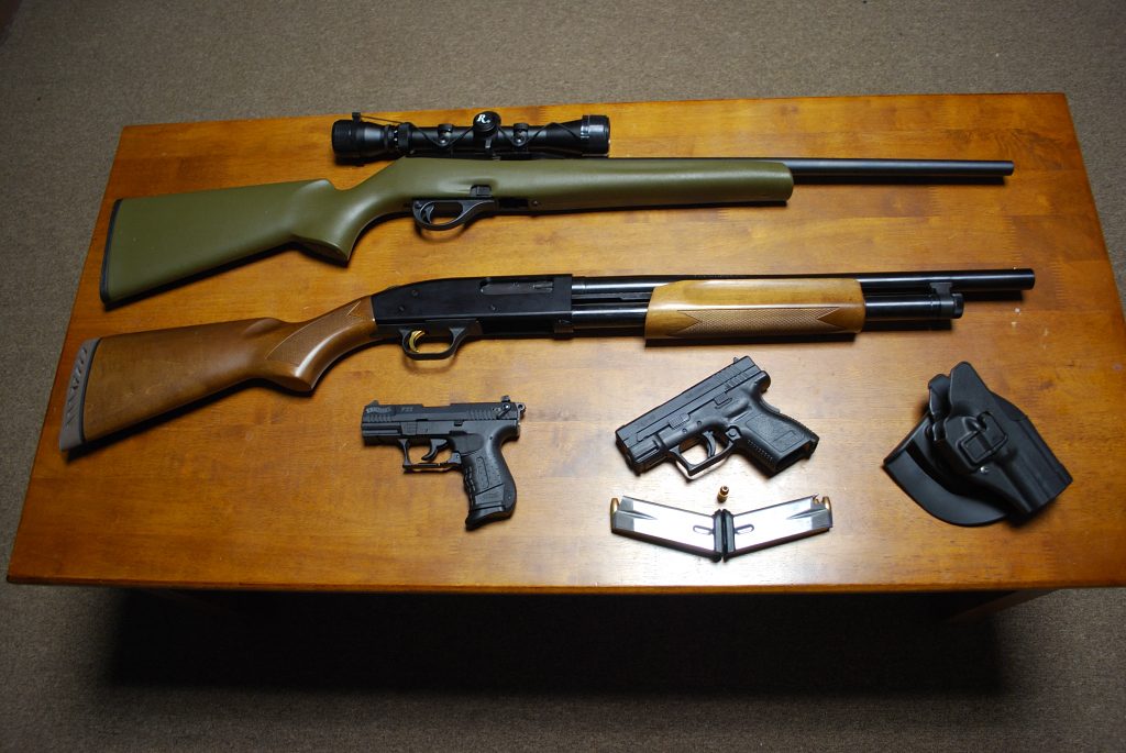 desk showing a bunch of great concealed guns