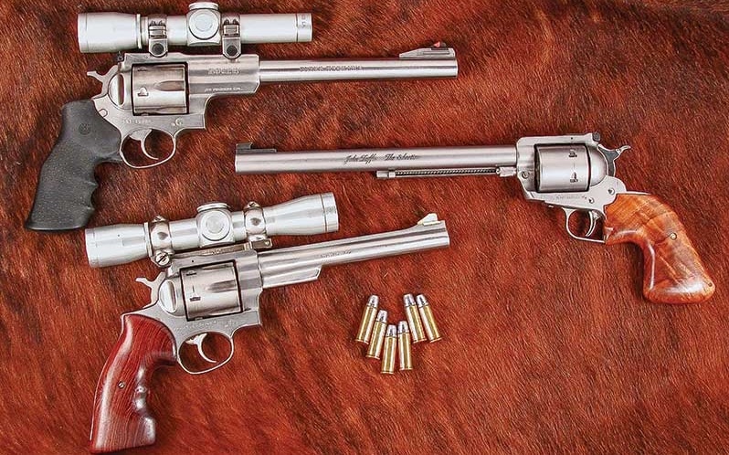 a picture of a Ruger Redhawk, Super Blackhawk and Super Redhawk in .44 Magnum next to each other